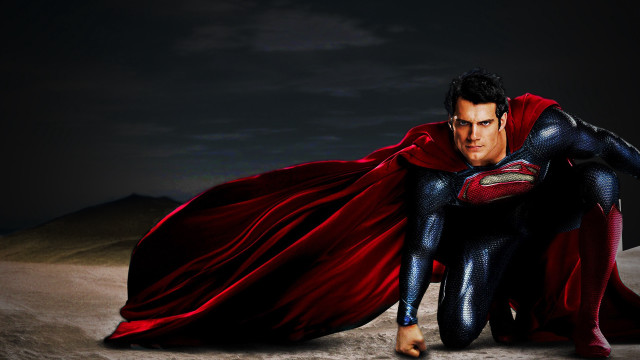 Man superman costume kneeling sand free wallpaper - medium preview image