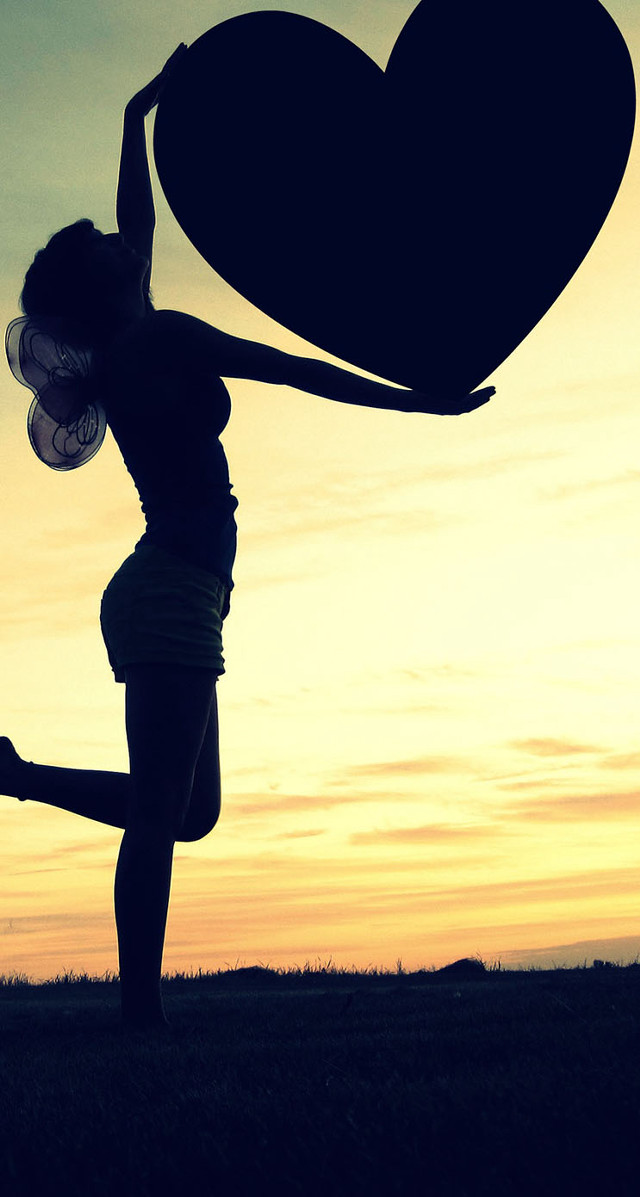 Woman holding heart sunset arms free wallpaper - medium preview image