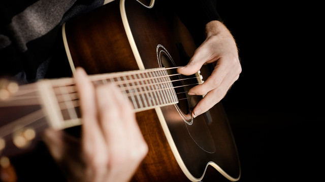 Person playing guitar hands strings free wallpaper - medium preview image