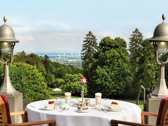 Table chairs white tablecloth city free wallpaper - medium preview image