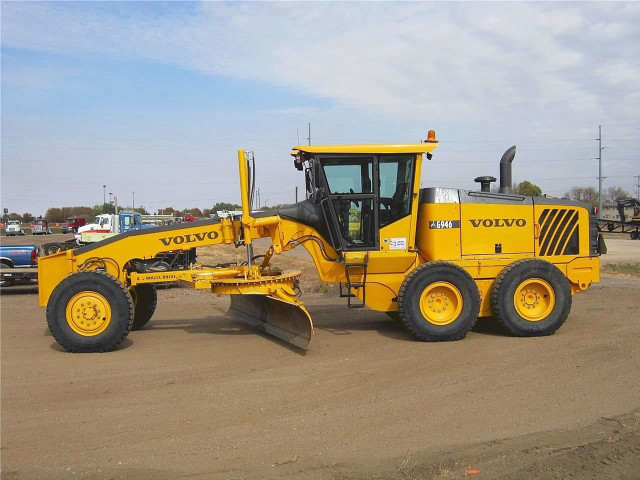 Yellow tractor parking lot snow free wallpaper - medium preview image