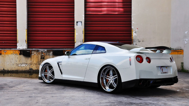 White sports car red garage free wallpaper - medium preview image