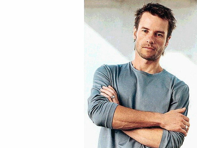 Man arms crossed serious expression free wallpaper - medium preview image