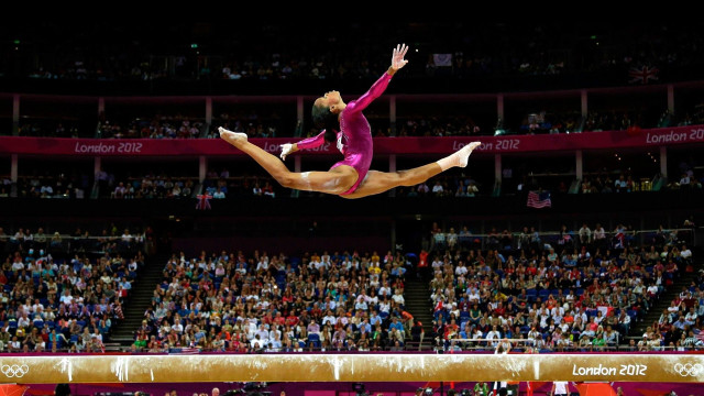 Woman pink leotard beam trick free wallpaper - medium preview image