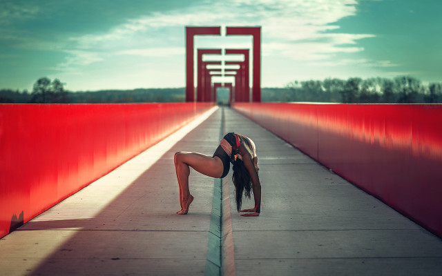 Woman bending bridge red pillars free wallpaper - medium preview image