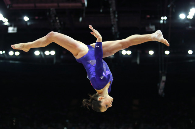 Woman handstand gymnastics crowd athletic free wallpaper - medium preview image