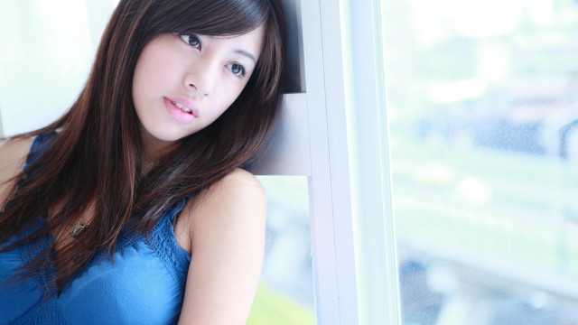 Woman blue dress window sill free wallpaper - medium preview image