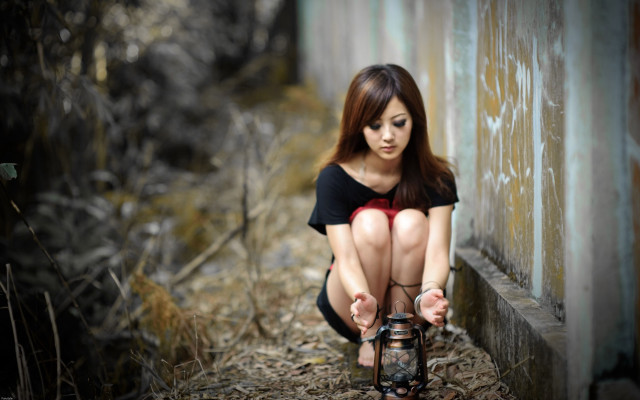 Woman kneeling lantern building open free wallpaper - medium preview image