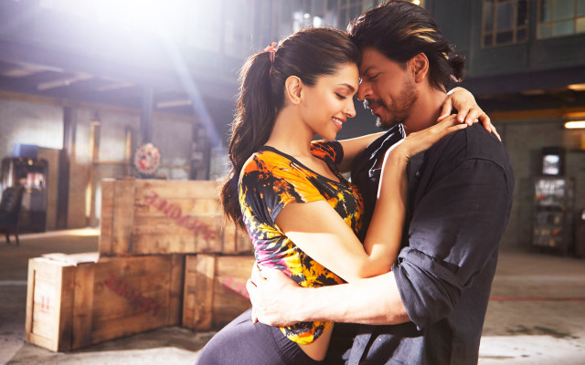 Man woman embracing warehouse boxes free wallpaper - medium preview image