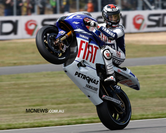 Motorcycle wheelie track crowd stands free wallpaper - medium preview image