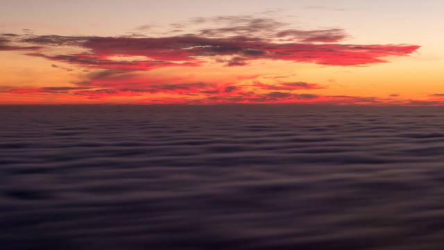 Sunset water clouds plane distance free wallpaper - medium preview image