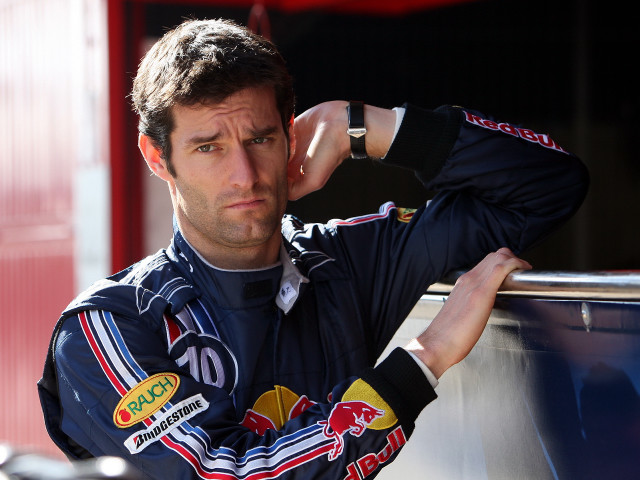 Man racing suit leaning wall free wallpaper - medium preview image