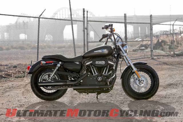 Motorcycle parked dirt lot fence free wallpaper - medium preview image