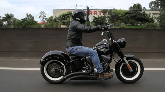 Man motorcycle street fence trees free wallpaper - medium preview image