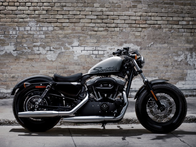 Black motorcycle brick wall building #2 free wallpaper - medium preview image