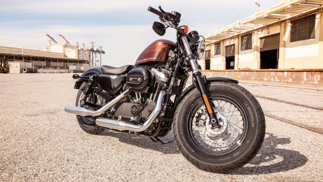 Motorcycle parked parking lot building #4 free wallpaper - medium preview image