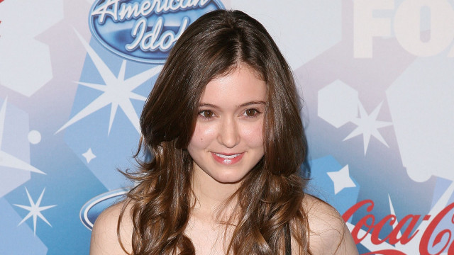 Young girl black dress smiling free wallpaper - medium preview image