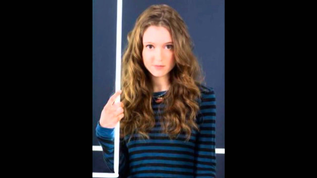 Woman thumbs up blue wall free wallpaper - medium preview image