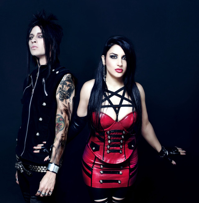 Man woman leather outfits posing free wallpaper - medium preview image