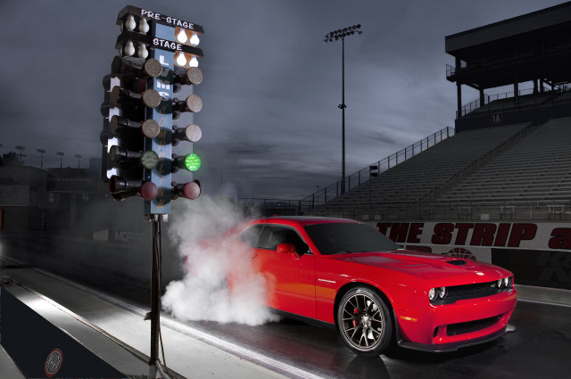 Red car smoking parking lot free wallpaper - medium preview image
