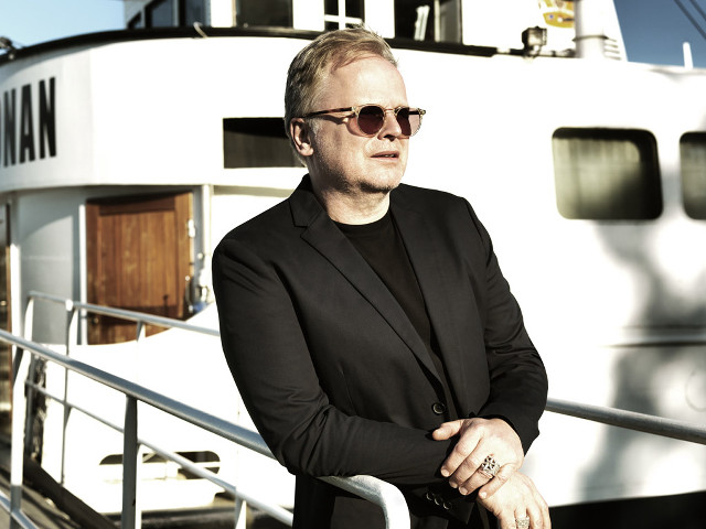 Man suit sunglasses boat portrait free wallpaper - medium preview image