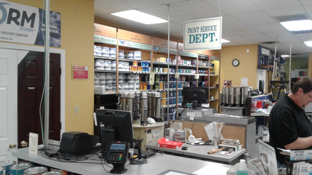 Man working store counter phone free wallpaper - medium preview image