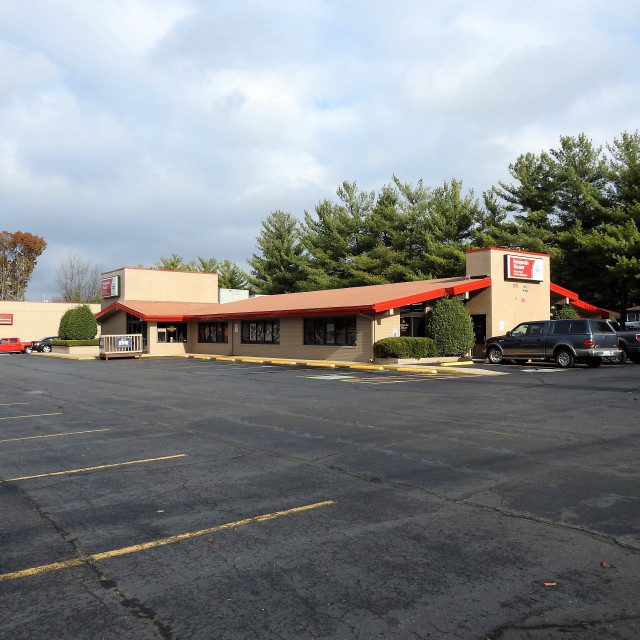 Motel parking lot trees cloudy free wallpaper - medium preview image