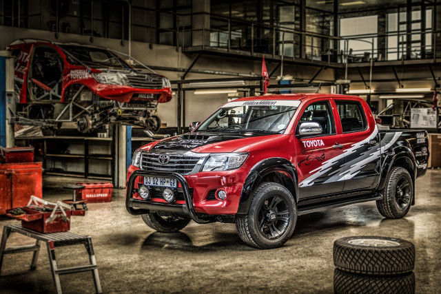 Red truck parked garage black free wallpaper - medium preview image