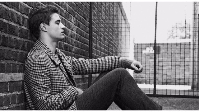 Man sitting brick wall fence free wallpaper - medium preview image