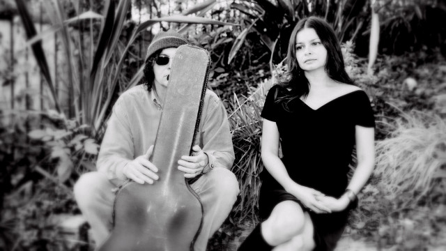 Man woman guitar case outdoors free wallpaper - medium preview image
