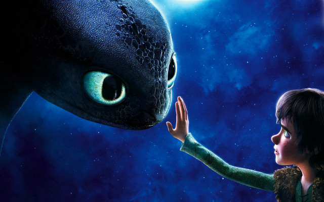 Young boy touching dragon face free wallpaper - medium preview image