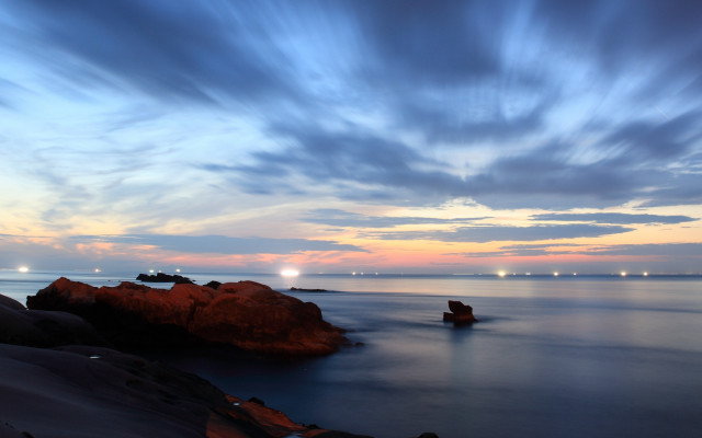 Water rocks clouds lights sky free wallpaper - medium preview image