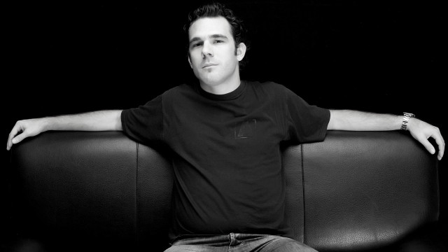 Man sitting couch arms crossed #4 free wallpaper - medium preview image