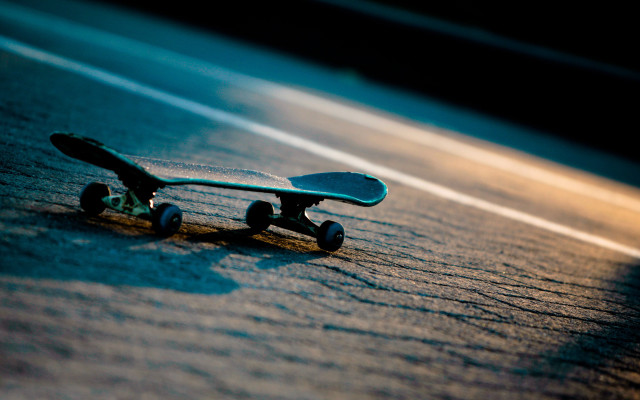 Skateboard laying ground wheels side #2 free wallpaper - medium preview image
