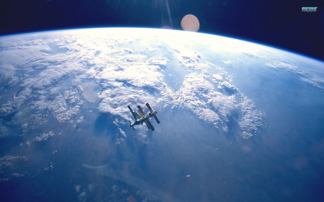 Space shuttle flying earth clouds #2 free wallpaper - medium preview image