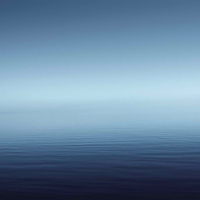 Lone boat calm ocean blue free wallpaper - medium preview image