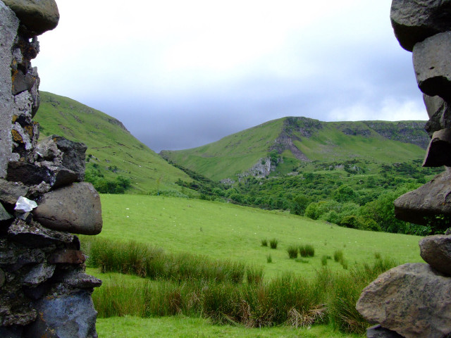 Grassy field stone wall mountain free wallpaper - medium preview image