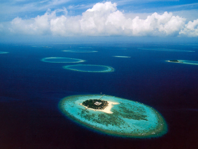 Small island ocean clouds water free wallpaper - medium preview image