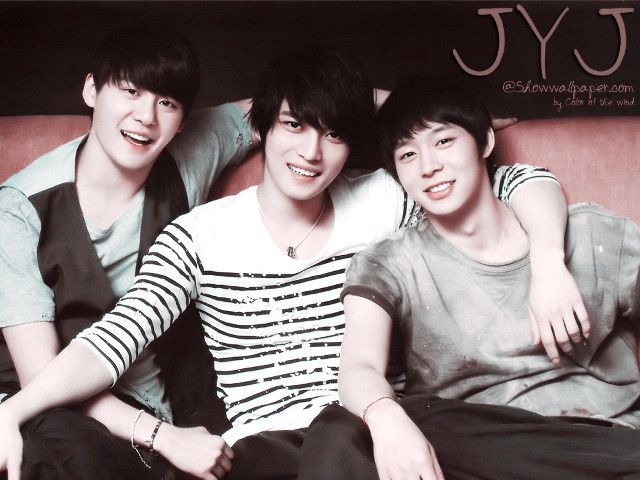 Three young men sitting couch free wallpaper - medium preview image