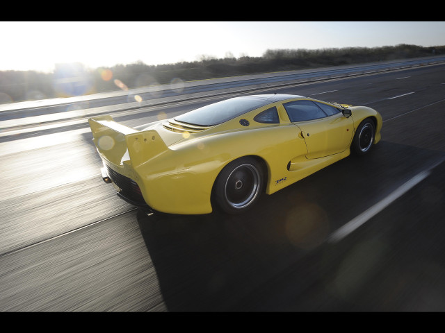 Yellow sports car highway forest free wallpaper - medium preview image