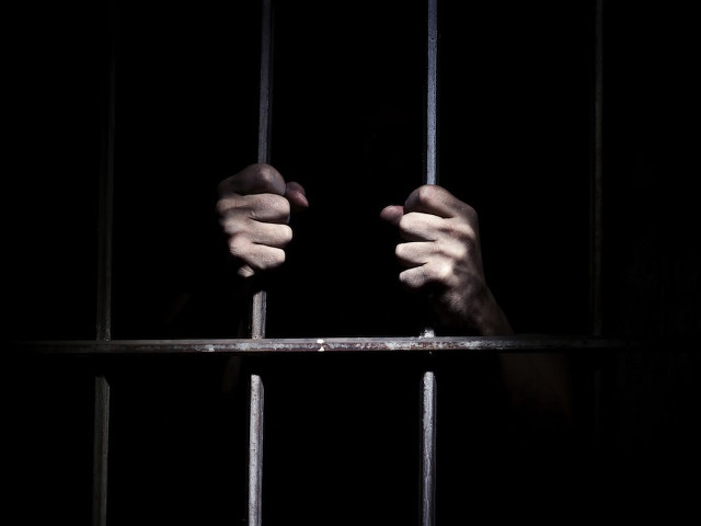 Person holding jail cell hands free wallpaper - medium preview image