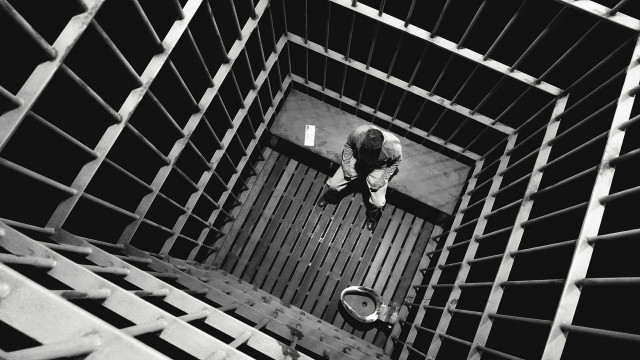 Person jail cell bars toilet free wallpaper - medium preview image