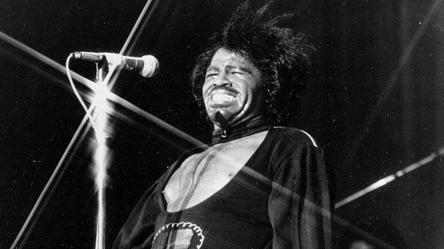 Man microphone singing 1970s funk free wallpaper - medium preview image
