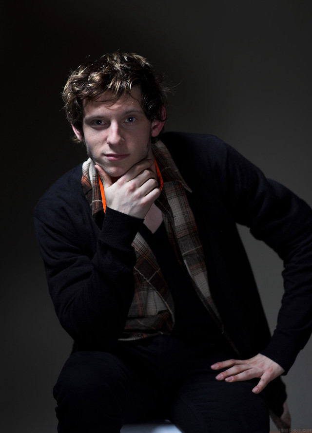 Man sitting stool hand chin free wallpaper - medium preview image