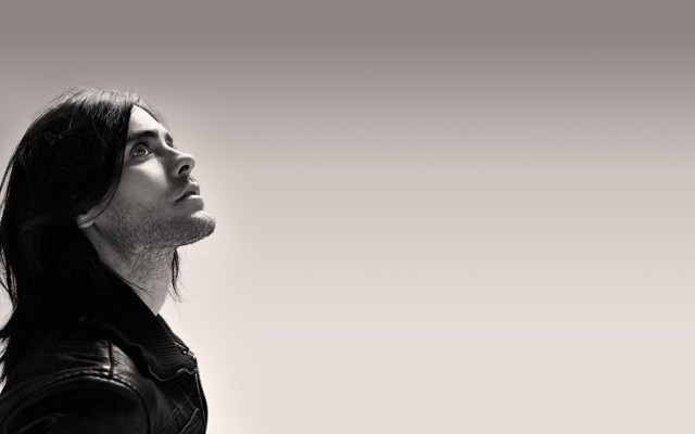 Man longhair leatherjacket lookingup blackwhite free wallpaper - medium preview image