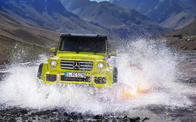 Yellow truck river water rocks free wallpaper - medium preview image