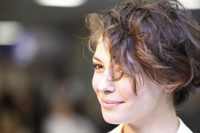 Messy haircut white shirt smiling free wallpaper - medium preview image