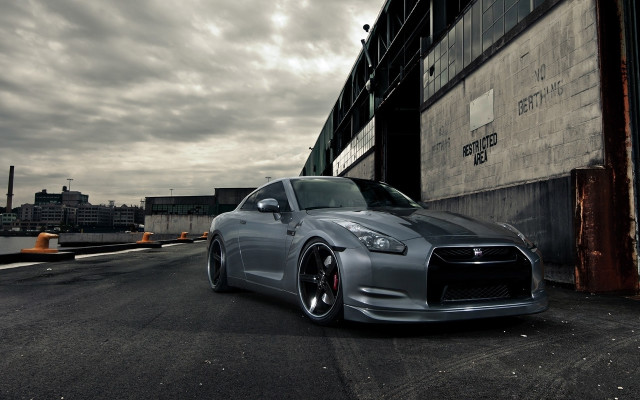Silver car parked building cloudy free wallpaper - medium preview image