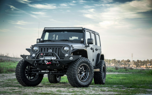 Black jeep parked field grass free wallpaper - medium preview image