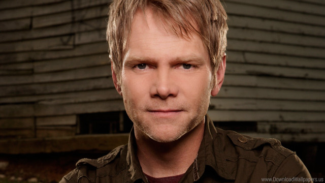 Blonde hair brown shirt serious free wallpaper - medium preview image